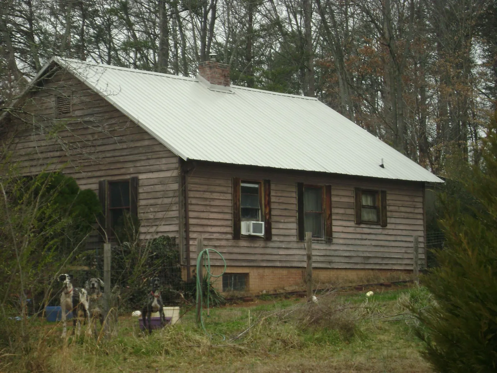 White metal roof on an old wood sided farmhouse, from a Metal Roof Installation job in Crystal Bay